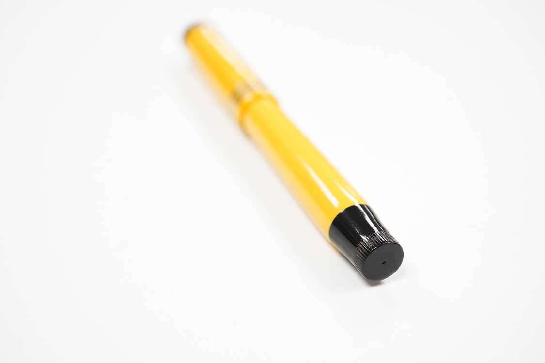 A Parker Lucky Curve Junionette in Mandarin yellow - mint pen but without barrel imprint which possibly left factory without one